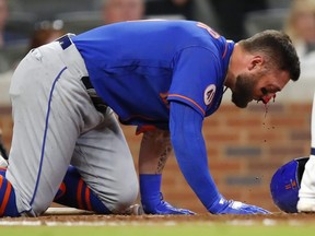 Kevin Pillar of the Mets takes a moment as his nose bleeds after being hit by a pitch in the 7th inning against the Braves at Truist Park in Atlanta, Monday, May 17, 2021.