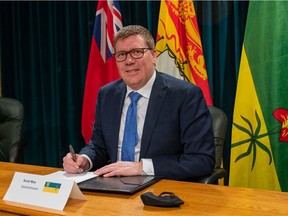 Saskatchewan Premier Scott Moe signs a memorandum of understanding on small-modular nuclear reactors.