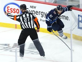 Kyle Connor celebrates his triple-overtime goal, which gave the Winnipeg Jets a first-round series sweep of the Edmonton Oilers in an NHL playoff series.