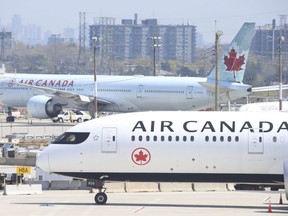 Airplanes on the tarmac outside of Toronto Pearson airport's Terminal 3 on April 23, 2021.
