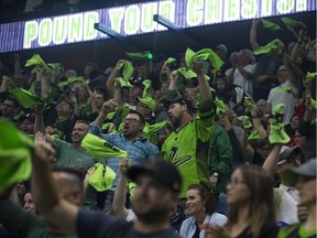Saskatchewan Rush fans celebrate after a goal is scored during the game at SaskTel centre in Saskatoon, SK on Saturday, May 26, 2018.