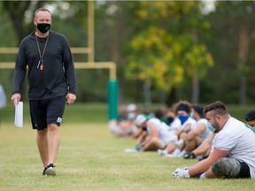 Huskies head coach Scott Flory patrols the field during a fall workout on campus.