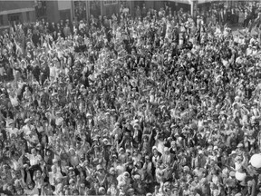 A crowd of kids, estimated at 5,000 to 6,000, gathers in downtown Saskatoon for a movie casting call in August of 1930.