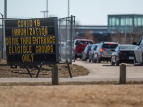 Vehicles line up at Saskatoon's drive-thru COVID-19 vaccination clinic at Prairieland Park. Photo taken in Saskatoon, SK on Monday, April 5, 2021.