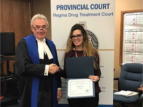 Meagan Jasper stands with Drug Treatment Court Judge Pat Reis upon completing the program in January 2019. Submitted photo.
