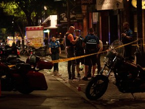 Police investigate the scene of a mass shooting in the Sixth Street entertainment district area of Austin, Texas, U.S. June 12, 2021.