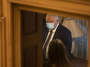 Ontario Premier Doug Ford sits in a back room at the Queen's Park Legislature in Toronto on Monday, June 14, 2021 as MPPs vote to pass government's legislation that will enable it to invoke the notwithstanding clause to deal with a court ruling on a third party election financing law.