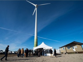 People gather for a media event at the Renewable Energy Storage Facility owned by Cowessess First Nation located east of Regina in October 2018.