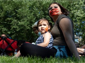 Keirra Tinker and Leah Kiskotagan painted their face for the Bring Them Home event at Kiwanis Park for a day of mourning and reflection for the residential school children instead of Canada Day celebrations. Photo taken in Saskatoon on July 1, 2021.