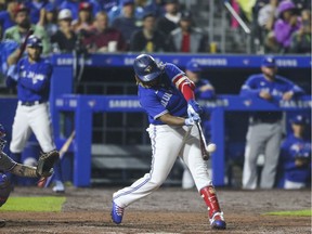 BUFFALO, NEW YORK - JULY 16: Vladimir Guerrero Jr. #27 of the Toronto Blue Jays hits a three-run home run during the seventh inning against the Texas Rangers at Sahlen Field on July 16, 2021 in Buffalo, New York.