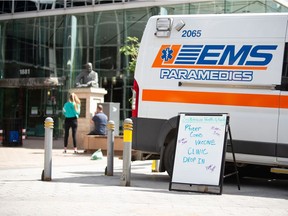 A sign indicates a pop-up COVID-19 vaccine clinic on Scarth Street in Regina, Saskatchewan on June 16, 2021.