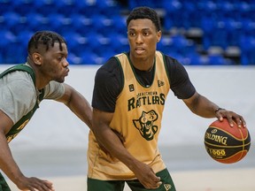 Devonte Bandoo, right, looks for a pass under pressure from Kemy Osse at the Saskatchewan Rattlers' CEBL training camp. Bandoo currently leads the Rattlers in scoring and most statistical categories. Photo taken in Saskatoon, SK on Tuesday, June 22, 2021.