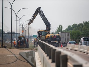 Construction crews work in the southbound lane of Circle Drive at Eighth Street on Monday, July 12, 2021.
