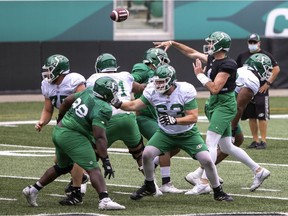 Many eyes will be on Saskatchewan Roughriders quarterback Paxton Lynch, right, during Saturday's scrimmage at Mosaic Stadium.