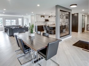 When transforming this 1980s-era bungalow at 123 Gathercole Cres., Studio 2.0 Interior Design knocked down multiple interior walls to create an inviting open concept great room. A custom crafted powder-coated aluminum divider creates separation between the foyer and the kitchen.