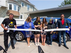 EGADZ executive director Don Meikle, Minister Lori Carr, Youth Advisory Committee members Samantha, Christa Jurgens and Emily, and Minister Paul Merriman cut the ribbon at the grand opening of the EGADZ Ground Zero transition home. Photo taken in Saskatoon, SK on Monday, July 26, 2021.