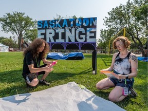 Crews set up for the Saskatoon Fringe Festival in W.E. Graham Park in Saskatoon, Sask. on July 27, 2021.