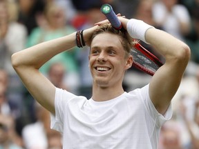 Canada's Denis Shapovalov celebrates winning his Wimbledon quarterfinal match against Russia's Karen Khachanov at the All England Lawn Tennis and Croquet Club, in London, England, Wednesday, July 7, 2021.