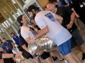 The Stanley Cup appears warped during Tampa Bay Lightning celebrations on Monday, July 12, 2021.