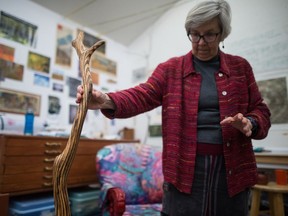 In this 2019 photo, fibre artist Martha Cole shows one of her wood pieces.