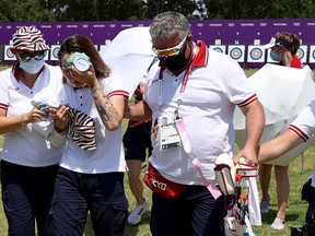 Svetlana Gomboeva collapsed as she checked her final scores and required assistance from staff and teammates who put bags of ice on her head to cool her down.