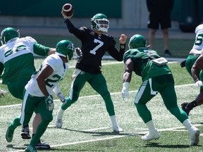 Roughriders quarterback Cody Fajardo, 7, throws a pass during Saturday's controlled scrimmage at Mosaic Stadium.