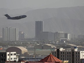A US Air Force aircraft takes off from the military airport in Kabul on August 27, 2021.