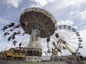 SASKATOON,SK--AUGUST 06/2019-0807 Standalone The Ex- Fairgoers enjoy rides at the Saskatoon Ex in Saskatoon, SK on Tuesday, August 6, 2019. (Saskatoon StarPhoenix/Liam Richards)