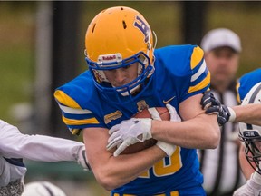 FILE PHOTO: Saskatoon Hilltops running back Carter Mclean runs he ball as the Saskatoon Hilltops play host to the Edmonton Wildcats in the Prairie Football Conference semi-final playoff game at SMF Field on October 20th, 2019 in Saskatoon, SK.  The Hilltops would go on to win with a final score of 31-7 over Edmonton.
