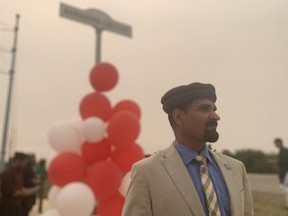 Ahmadiyya Muslim Jama'at Saskatoon spokesman Mubarik Syed stands near the new sign for Ahmadiyya Crescent. The new name for the portion of Glazier Road was unveiled August 15, 2021.