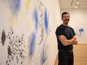 Saskatoon-born artist Zachari Logan with one of his drawings, part of his first solo exhibition at the Remai Modern gallery, titled Ghost Meadows.