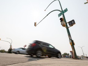 Cars drive along 22nd street west at the Ave W intersection. Photo taken in Saskatoon, Sask. on Wednesday, August 18, 2021.