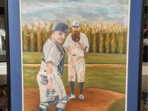 A painting depicts pitcher James Owens and his catcher dad, Michael Owens, while experiencing the Field of Dreams first-hand in Dyersville, Ohio, in 2017.