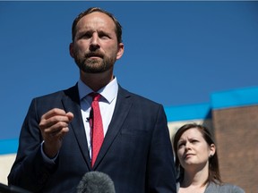 NDP Leader Ryan Meili and official Opposition health critic Vicki Mowat call for Health Minister Paul Merriman to resign in front of Merriman's office in Saskatoon on Monday, Aug. 30, 2021.