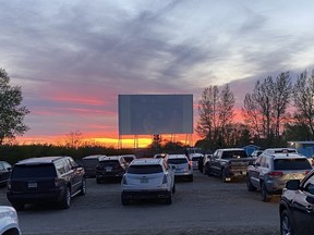 People watch a movie at the Manitou Beach Drive-In Theatre.