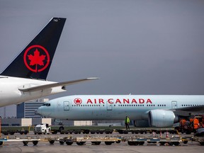 Air Canada planes parked at Toronto Pearson Airport in Mississauga, Ont., on April 28, 2021.