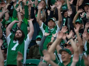 Saskatchewan Roughriders fans do the wave during a CFL football game against the Ottawa Redblacks at Mosaic Stadium in Regina, Saskatchewan on August 21, 2021. BRANDON HARDER/ Regina Leader-Post