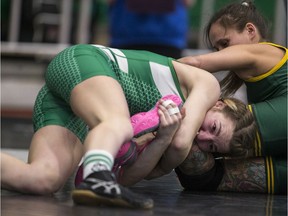 In this SP file photo, University of Saskatchewan Huskies wrestler Katie Dutchak, left, takes on Tina Trombley from the University of Regina in the 48-kilogram weight class during the CanWest Wrestling Championships at the PAC on the U of S campus in Saskatoon on Friday, February 10, 2017.