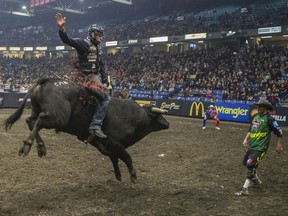 Brock Radford rides the bull Grey Eyes during the PBR (Professional Bull Riders) Canadian finals at SaskTel Centre in Saskatoon, SK on Saturday, November 23, 2019.