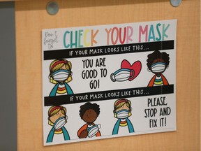 Signs on how to safely put on your mask are posted in a Grade 1 classroom at Sylvia Fedoruk school on Thursday, September 3, 2020.
