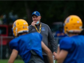 Hilltops players practice recently as head coach Tom Sargeant looks on.