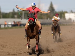 Bubba Poitras celebrates his win as he passes the finish line during Heat 1 of the Chief's Race — one of the last races at Marquis Downs.