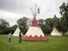 Three teepees were set up for the day to celebrate the first anniversary of the Walking With Our Angels camp, which was started by Tristen Durocher. Prescott Demas works on finishing setting up his teepee on Saturday, September 11, 2021 in Regina.