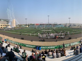 University of Saskatchewan Huskies football players run onto the Griffiths Stadium turf prior to their non-conference game against the Manitoba Bisons on Saturday.