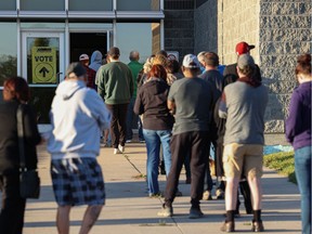 People line up to cast their ballots in the 2021 federal election at  the Shaw Centre in Saskatoon.