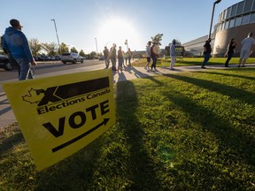 People line up to cast their ballots in the 2021 federal election at Saskatoon's Shaw Centre on Sept. 20, 2021.