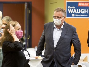 Kevin Waugh gathers with supporters at his campaign office as votes are counted in the 2021 federal election.