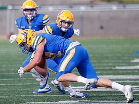 Konnor Johnson's late-game interception helps seal the deal for the Saskatoon Hilltops in a 25-10 Prairie Football Conference victory Sunday over the visiting Winnipeg Rifles at SMF Field in Saskatoon (LOUIS CHRIST PHOTO/Saskatoon Hilltops_