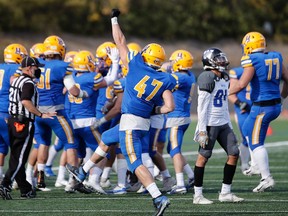 Riece Kack (47) celebrates a turnover by the Saskatoon Hilltops defence in a 25-10 Prairie Football Conference victory Sunday over the visiting Winnipeg Rifles at SMF Field in Saskatoon (Louis Christ photo taken Sept. 26, 2021.)