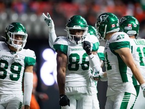 Saskatchewan Roughriders' Ricardo Louis, 86, on Friday celebrates his first CFL touchdown — a 24-yard grab against the B.C. Lions.